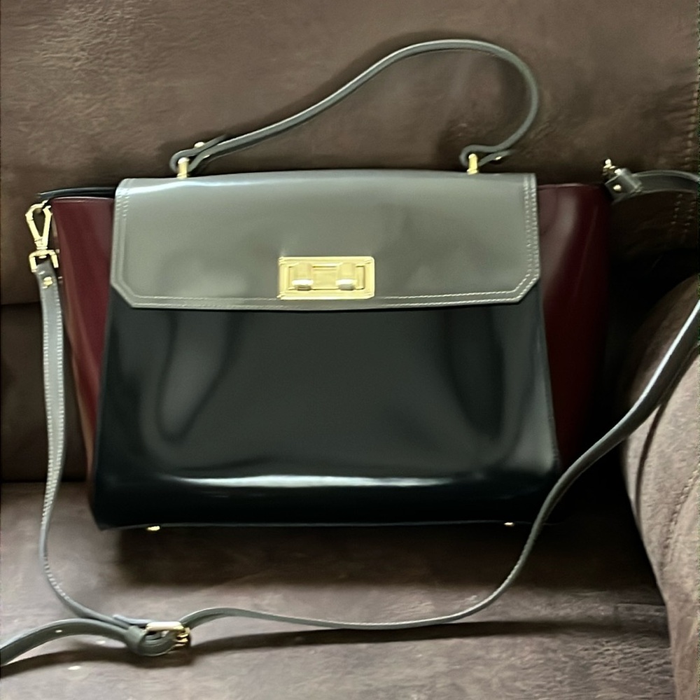 Gianni Notaro purse. Brand new, never been used. Colors are black and gray.